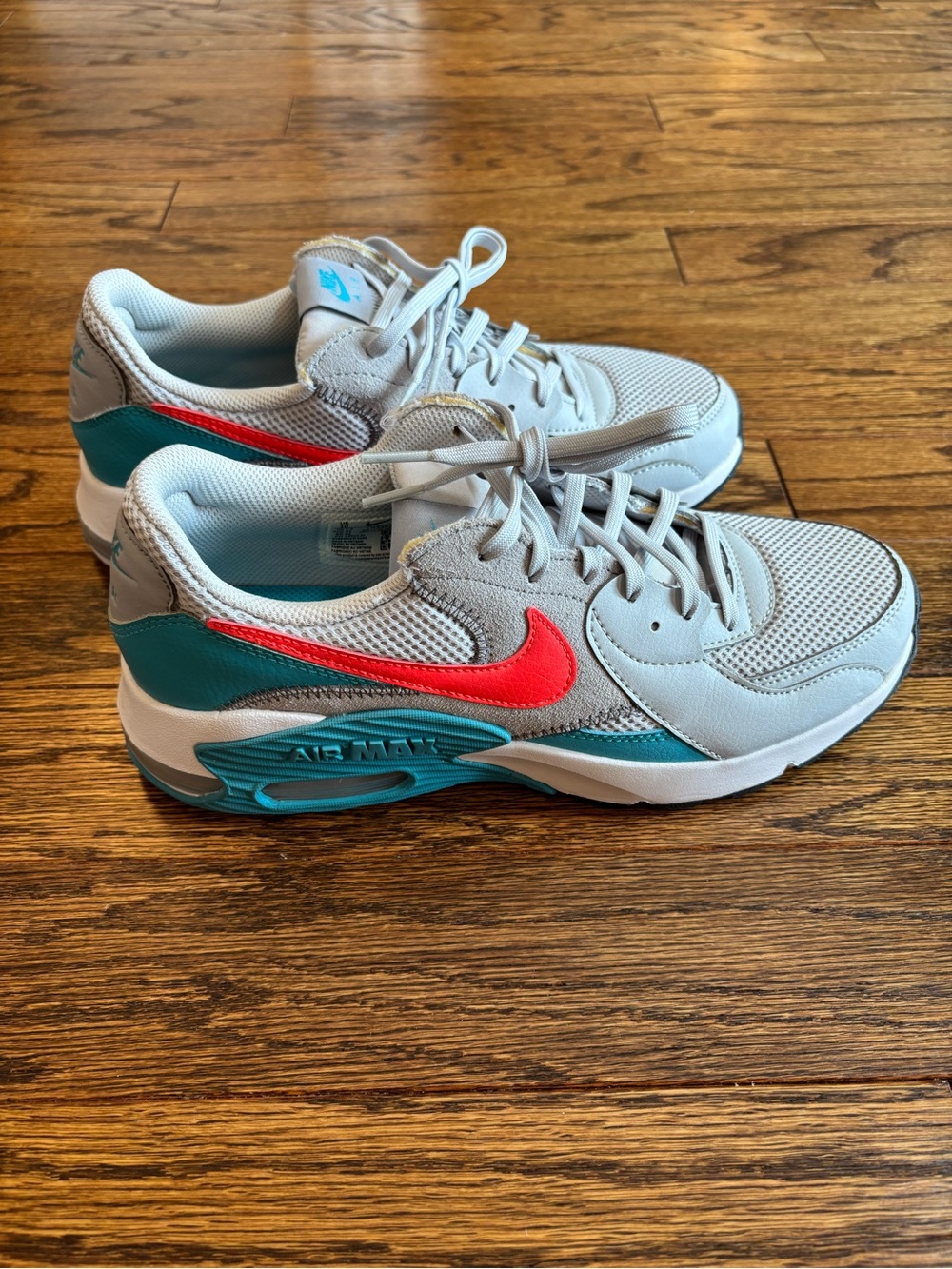 Nike Light Gray Air Maxes with Teal and Orange Accents